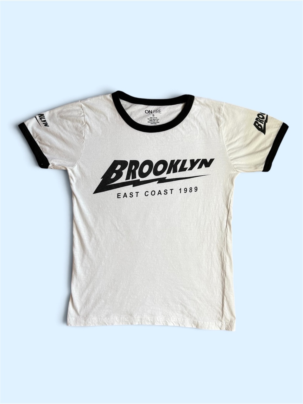 On Fire White T-Shirt with Black Trim and 'Brooklyn' Graphic